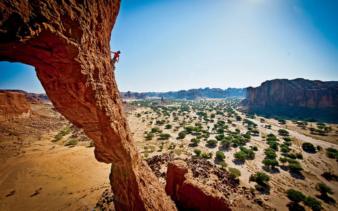 James Pearson making the sketchy first ascent of the Arch of Bishekele in Chad's Ennedi Desert