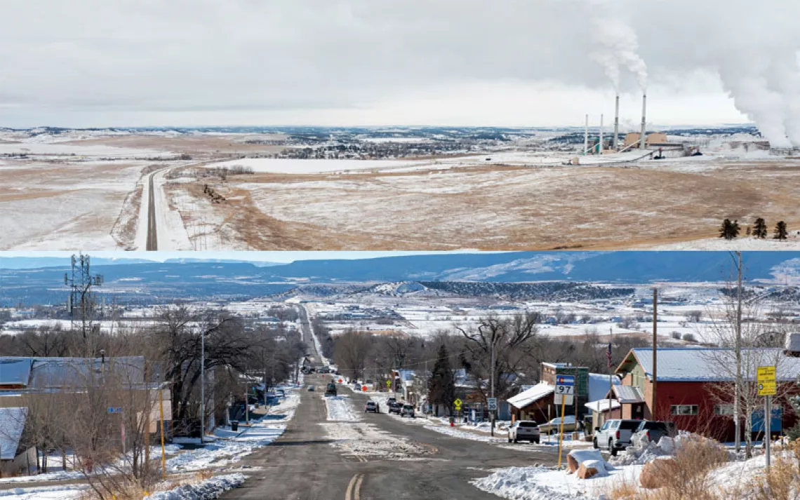 The Colstrip power plant sits in an area of snow-covered open land.