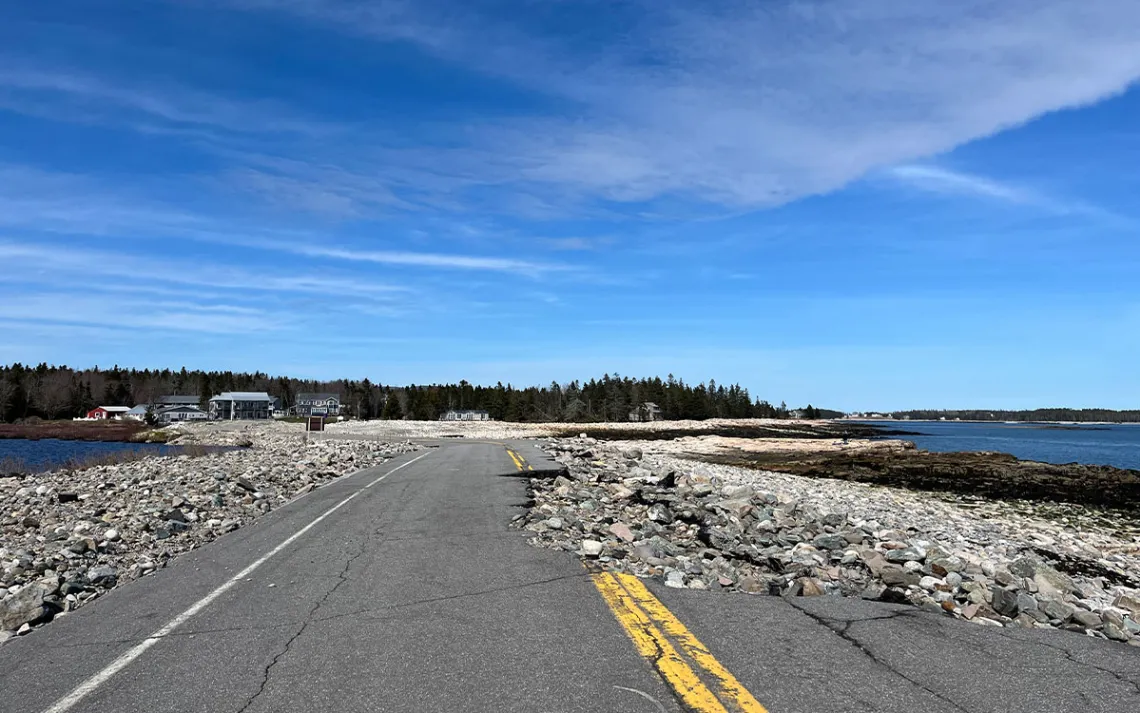 Asphalt from a road is missing after a storm.