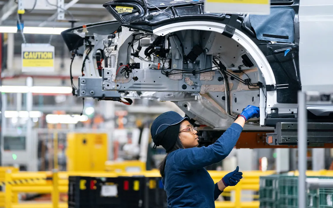 An employee works in the X3 X4 assembly hall at the BMW Spartanburg plant in Greer, S.C.