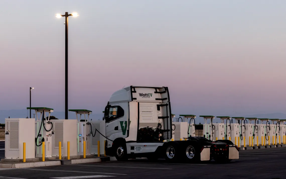 A WattEV white truck charging at a facility in Bakersfield, California