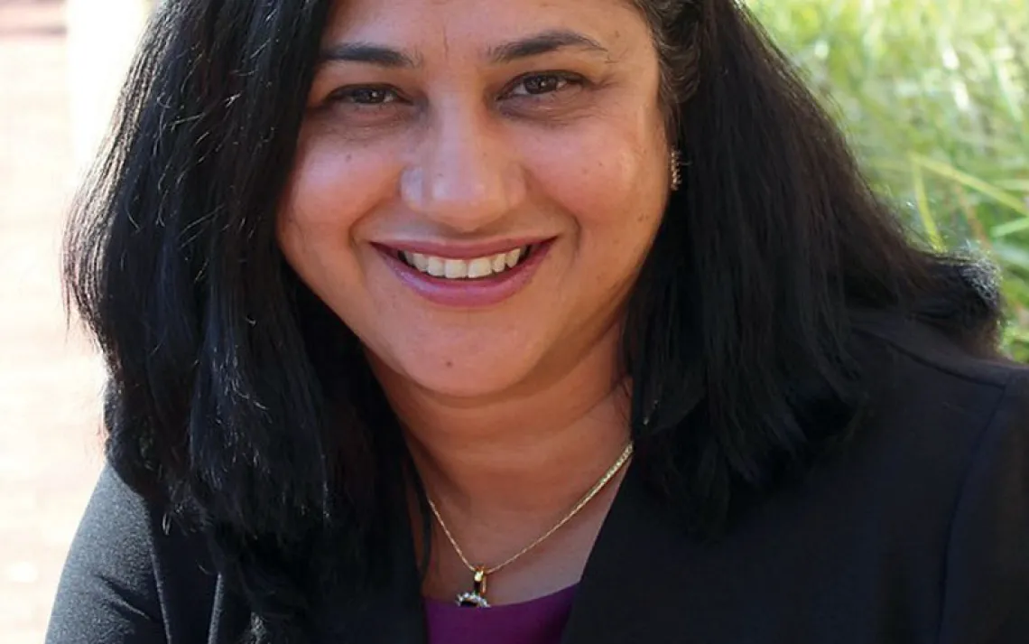 Portrait of Shruti Bhatnagar smiling at the camera.