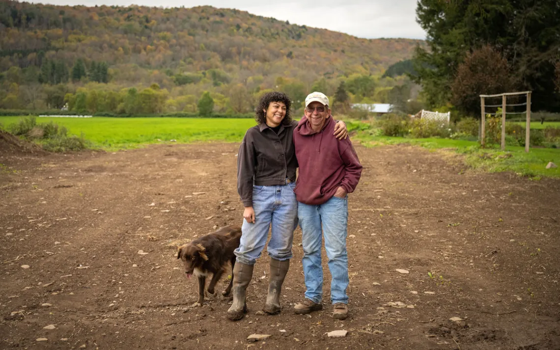 Tom Hutson (transitioning farmer) and Sea Matias (new generation farmer) stand together on the commons. Photo courtesy of Jamieson Johnson 