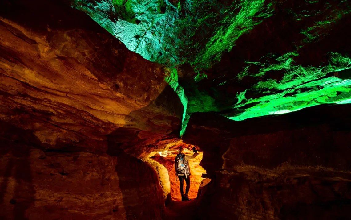 A spooky Laurel Cavern with neon lights illuminating the cave