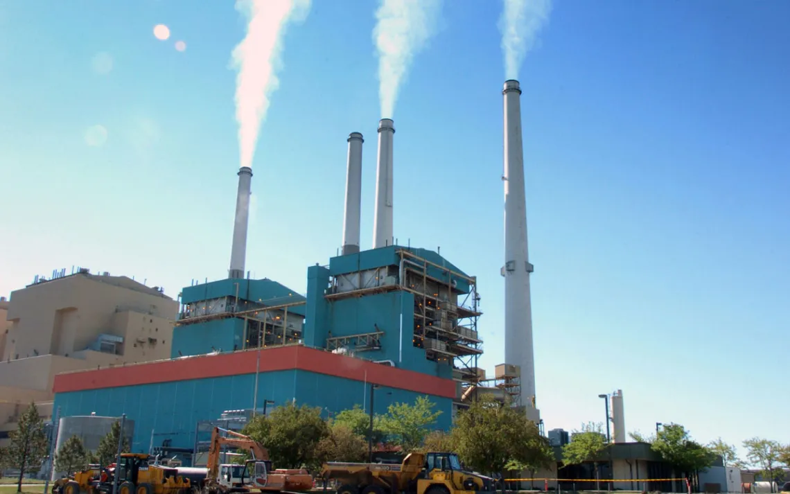 In this July 1, 2013, file photo, smoke rises from the Colstrip Steam Electric Station, a coal burning power plant in in Colstrip, Mont.