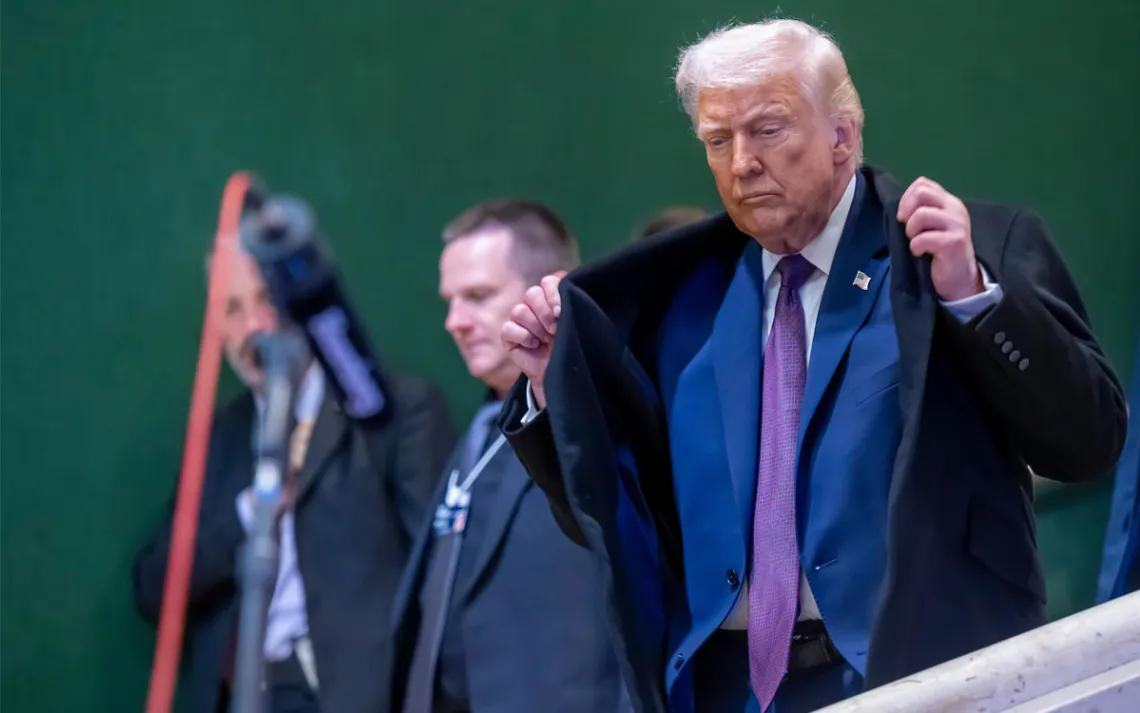 President Donald Trump walks down stairs during the Annual Meeting of the World Economic Forum, WEF, in Davos, Switzerland, Thursday, Jan. 22, 2026. (Laurent Gillieron/Keystone via AP)
