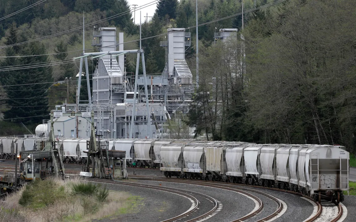 In this file photo taken April 29, 2011, rail cars are parked on tracks at the coal-burning TransAlta plant, near Centralia, Wash. Washington state’s largest polluters released 30 percent more greenhouse gases in 2013 than the previous year, according to the latest data by the U.S. Environmental Protection Agency. The TransAlta plant, the state’s only coal-fired power plant, lead the way, releasing 7.5 million metric tons of carbon dioxide and other gases blamed for global warming. 