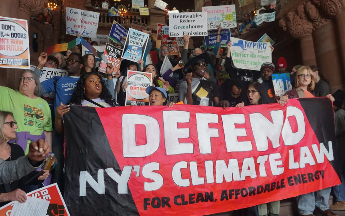 Organizers stand at the base of the million dollar staircase in the New York state capitol. 