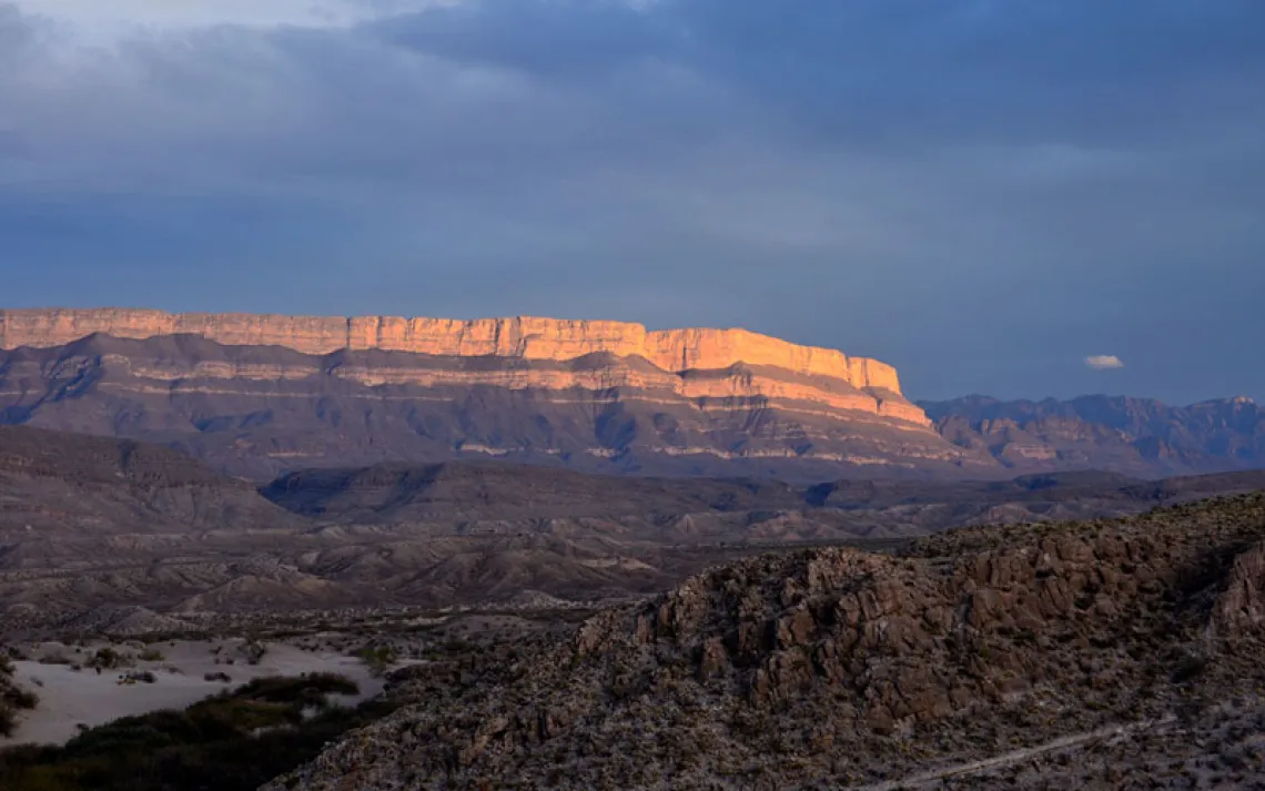 Sun setting over a cliff face in Big Bend National Park