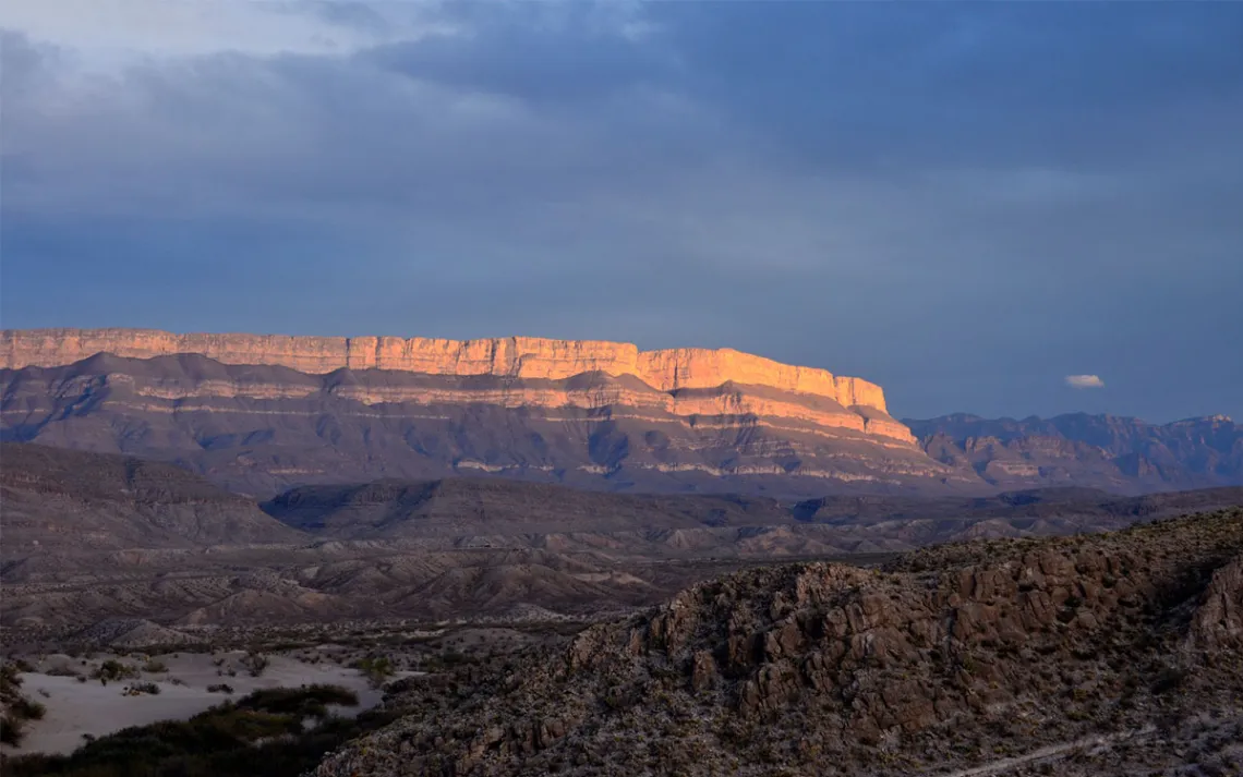 Sun setting over a cliff face in Big Bend National Park