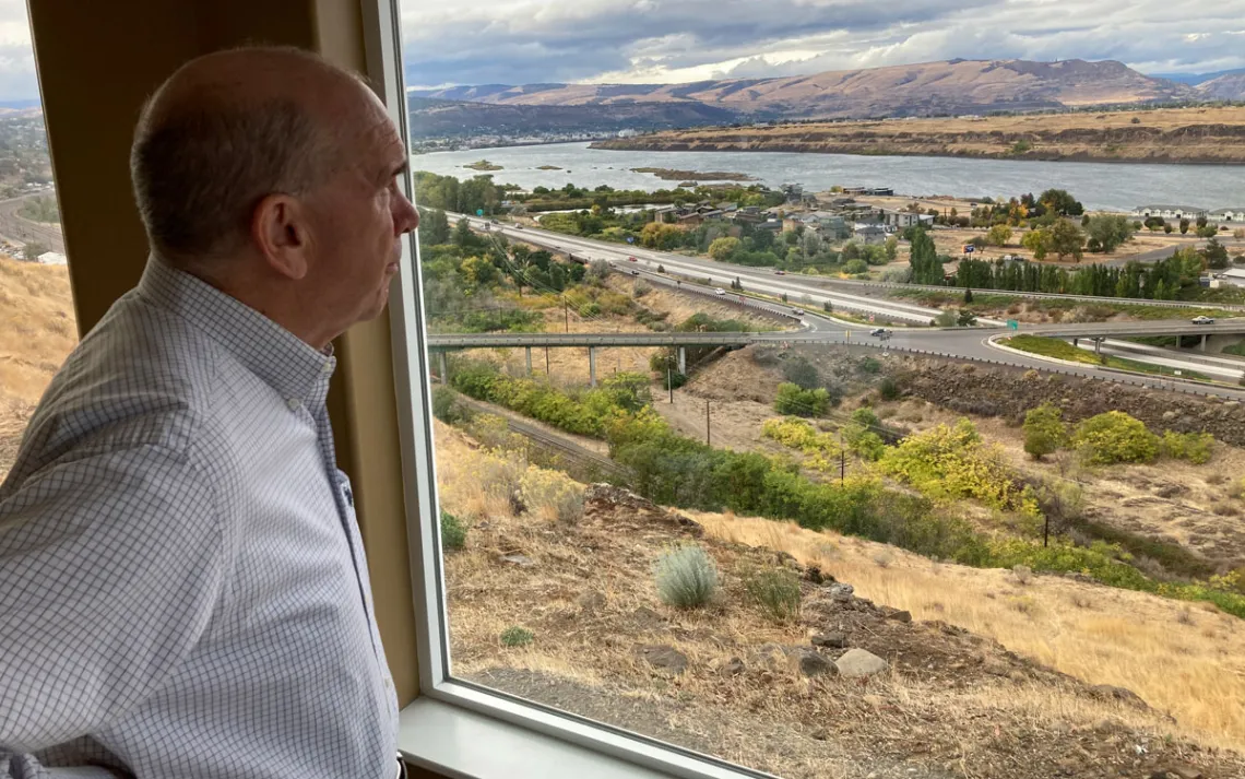 The Dalles Mayor Richard Mays looks at the view of his town and the Columbia River from his hilltop home in The Dalles, Ore. Residents of The Dalles should soon know how much of their water Google's data centers there have been using to cool the computers, after a lawsuit seeking to keep the information confidential was dropped.