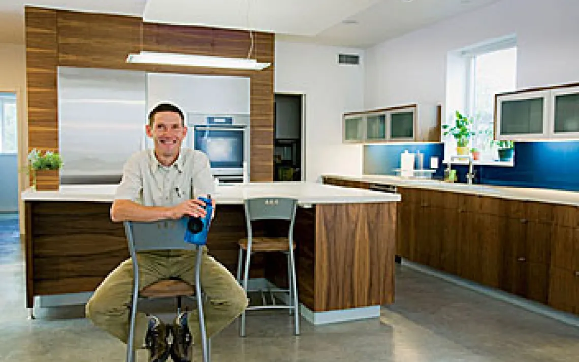 Architect Dave Brach with his concrete countertops and floors, which add to the Breezeway House's energy-storing thermal mass