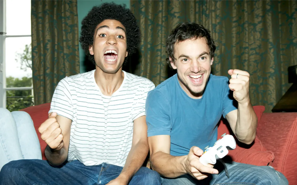 Two gamers on the sofa 