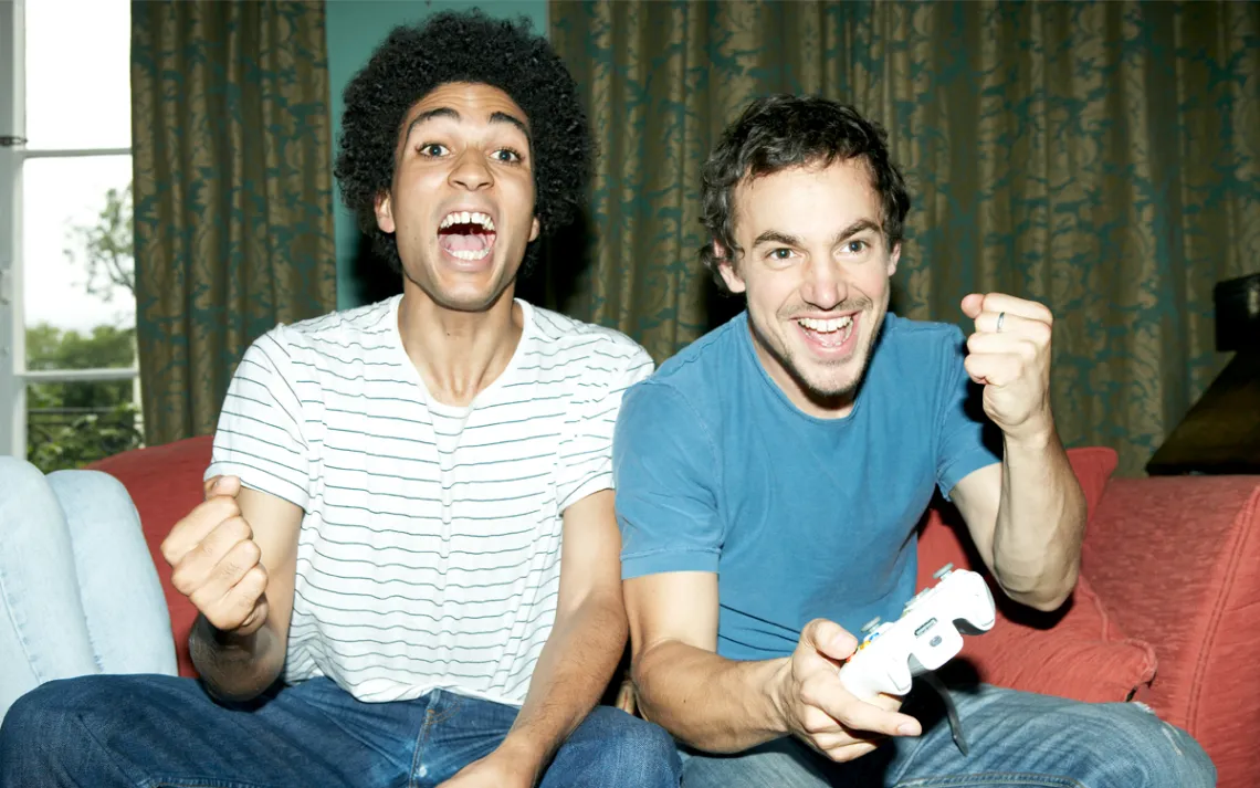 Two gamers on the sofa 