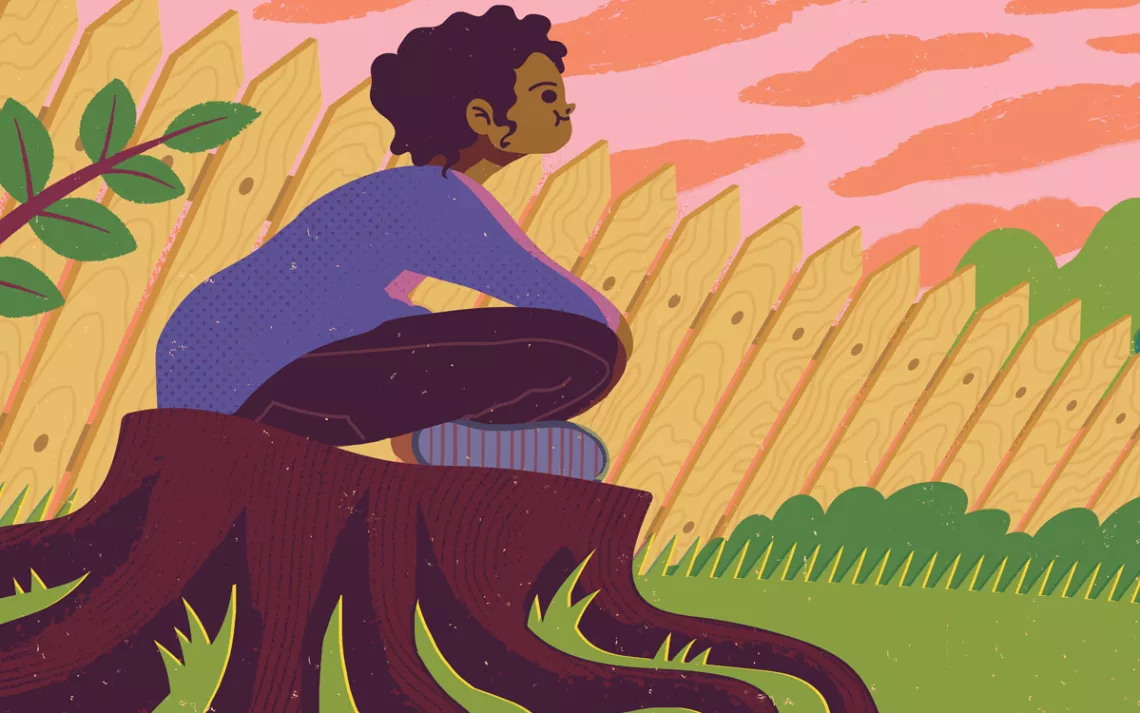 A girl sitting on a tree stump, looking toward the back of her house and an airplane.