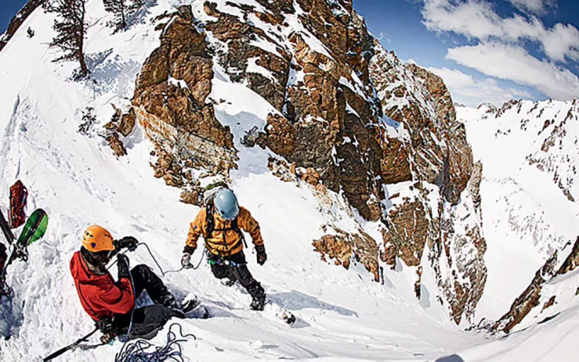 At Sawtooth Mountain Guide's backcountry camp, participants practice hurtling down a steep slope.