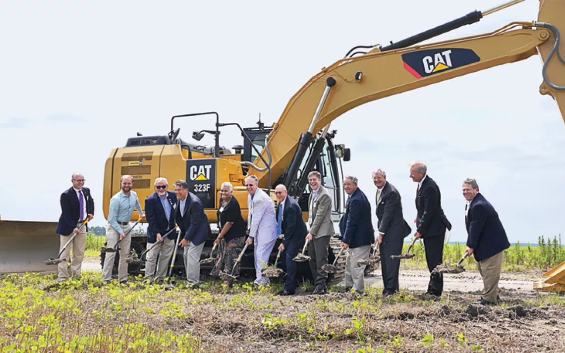  Iberdrola Renewables and Amazon Web Services break ground in an empty field in rural North Carolina.