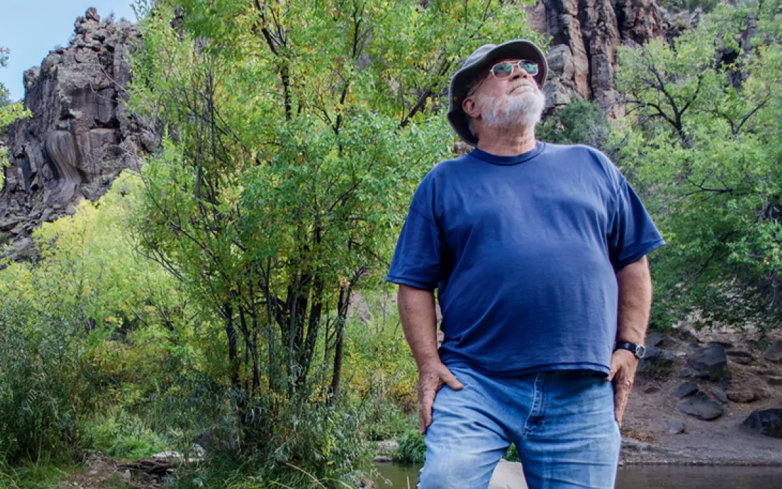 Retired school teacher Eric Patterson tests streams for water quality in New Mexico.