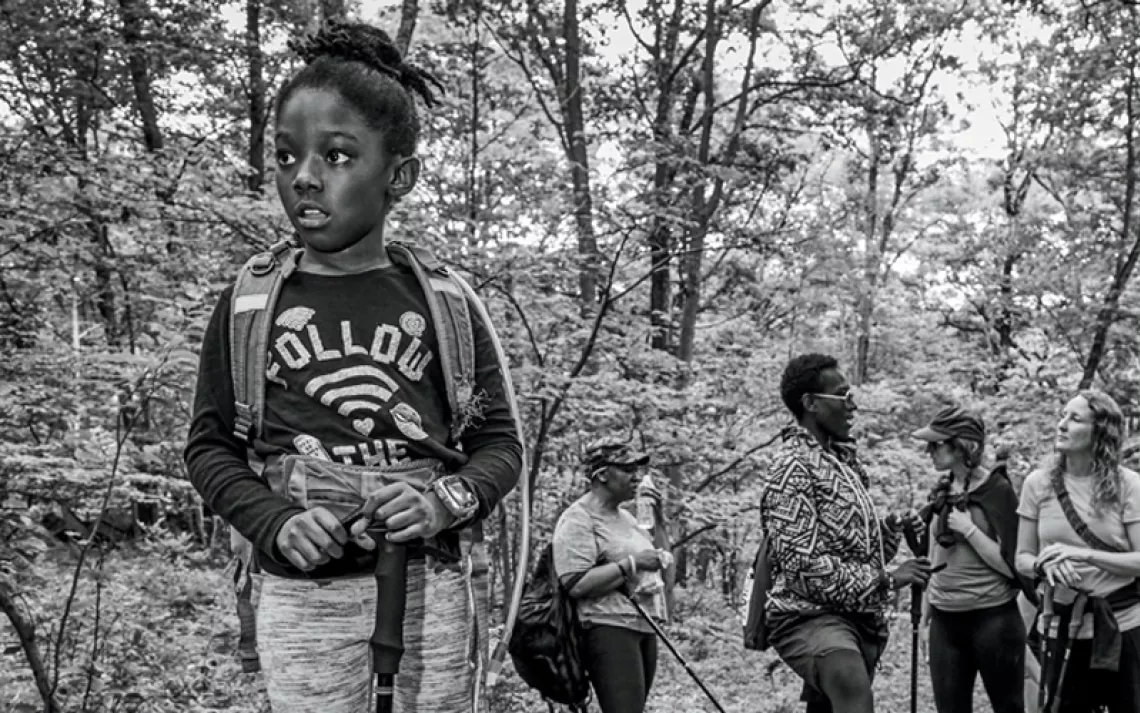 Harlem, daughter of navy veteran Moet Valdez, takes the lead during a hike in New York's Harriman State Park. 