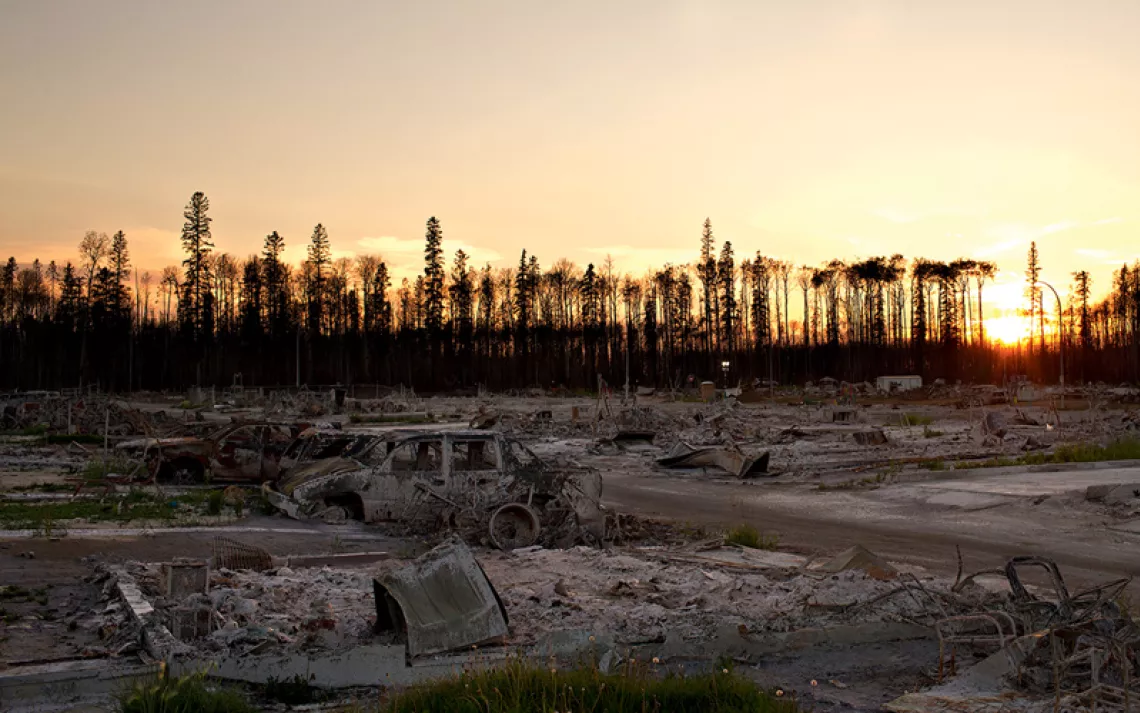 A wildfire-burned residential area seen at sunset in Fort McMurray Alberta, on June 28, 2016.