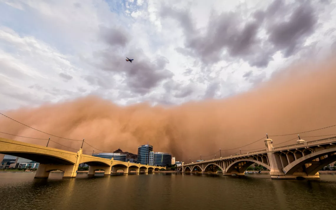 A huge haboob dust storm, a wall of brown, blows through downtown Tempe (Phoenix).