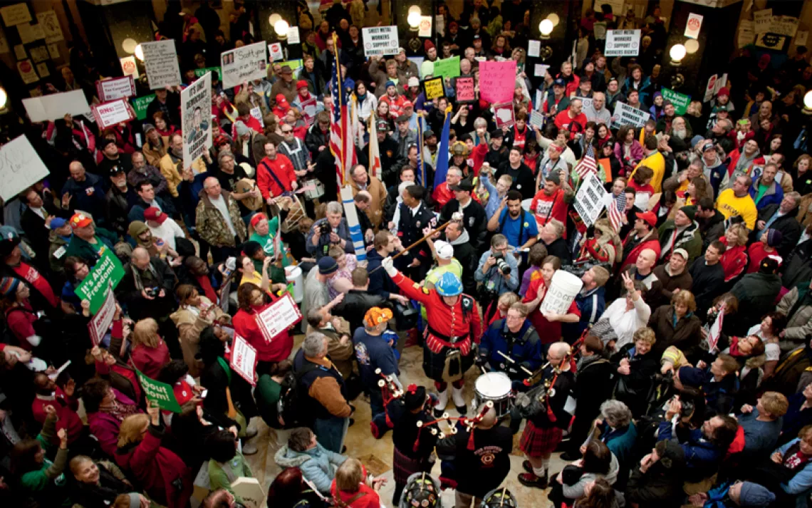 Union firefighters and Wisconsin residents protest in the Madison state capitol.