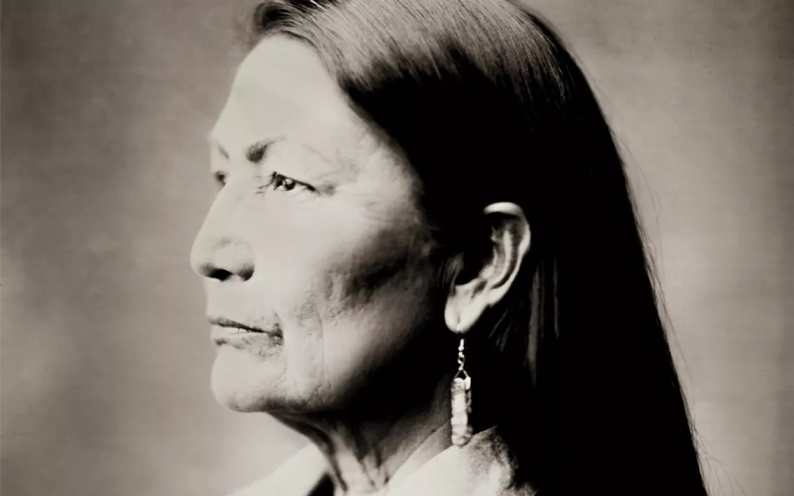 Deb Haaland sits facing the camera with her hands in her lap.