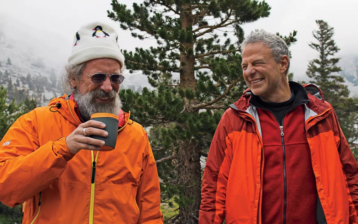 Matt Dyer and Rich Gross share a laugh near the group's commissary in the Sierra Nevada