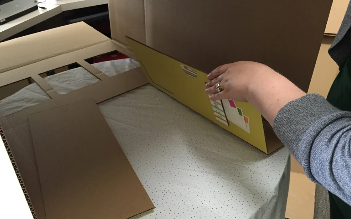 If you have completely cut out the doors, place each door back in its place and tape along one side. The tape will create a nice hinge, and the door will stay open more easily.