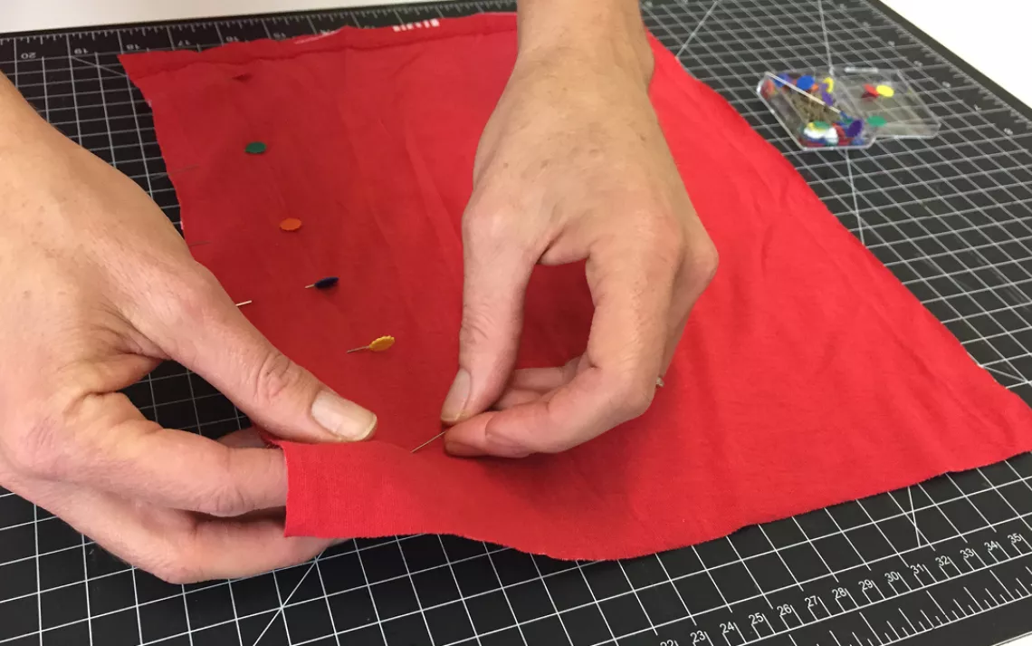 If like me, you forgot to turn the shirt inside out in step 1, do this now and pin the two pieces of fabric together. 