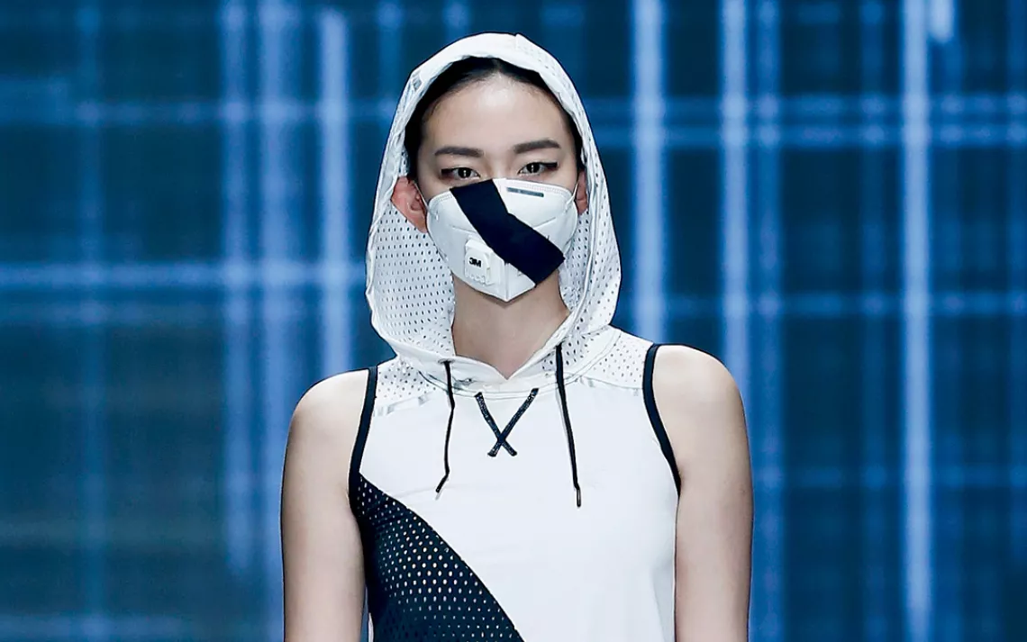 A model presents a creation featuring a facial mask during the QIAODAN Yin Peng Sports Wear Collection of the China Fashion Week 2015 S/S Collection in Beijing, capital of China, Oct. 28, 2014