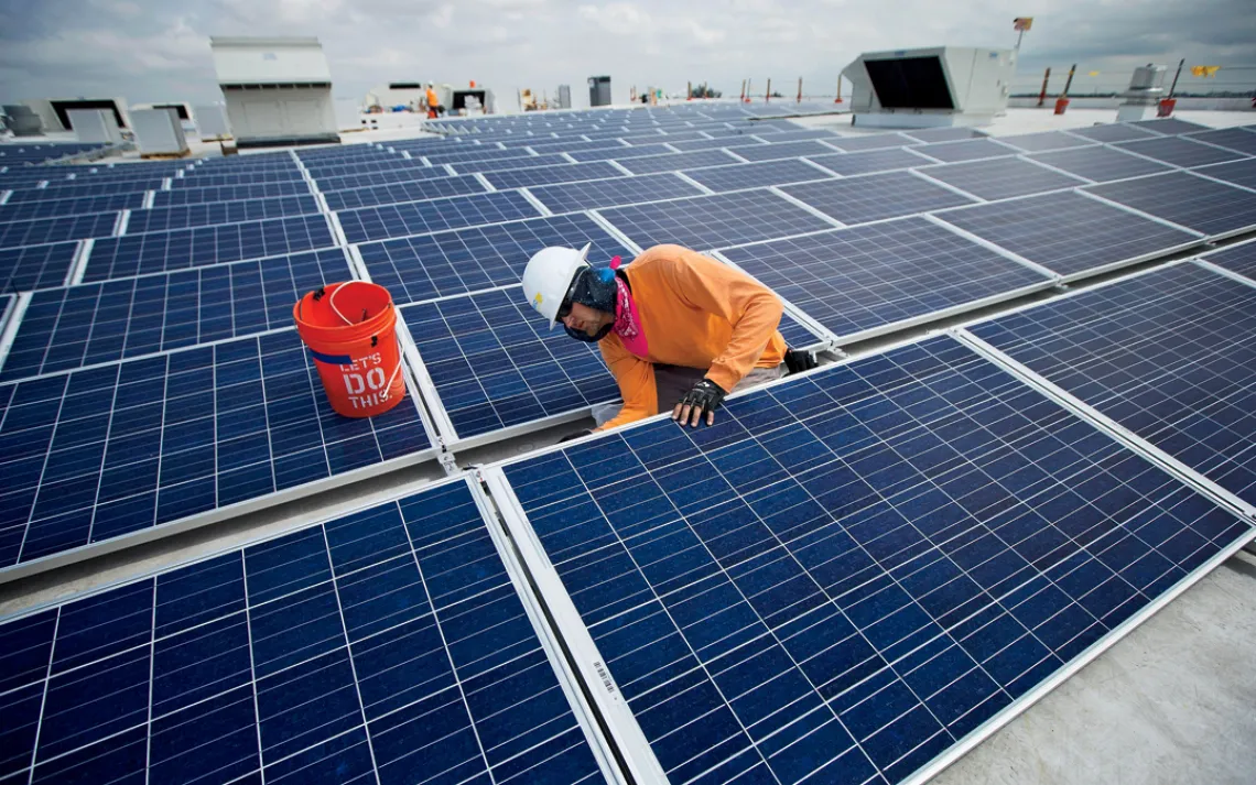 Ikea solar panels: Neil Black works on the installation of South Florida's largest solar panel array atop the future IKEA store in Miami, Wednesday, April 16, 2014. This is Ikea's 40th solar powered project in the U.S. The 178,000 square foot solar array 