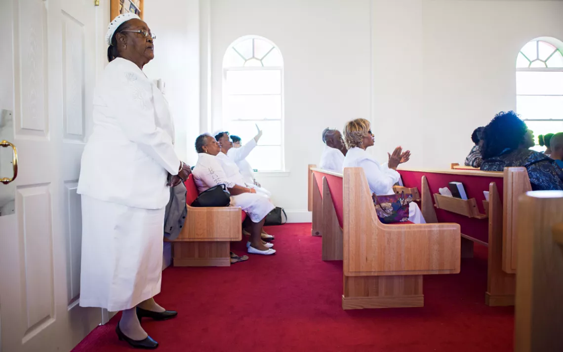 Betty Wilson stands during a service at Saint Paul Missionary Baptist Church in Ironton, Louisiana.