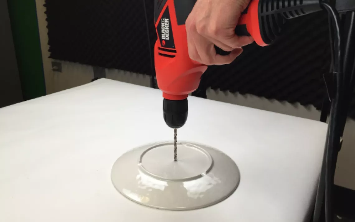  Slip a washer onto your carriage bolt, and slide it down to the bottom. Slide the bowl to the bottom to rest on the washer. Then apply a little glue to the washer to help stabilize the bowl.