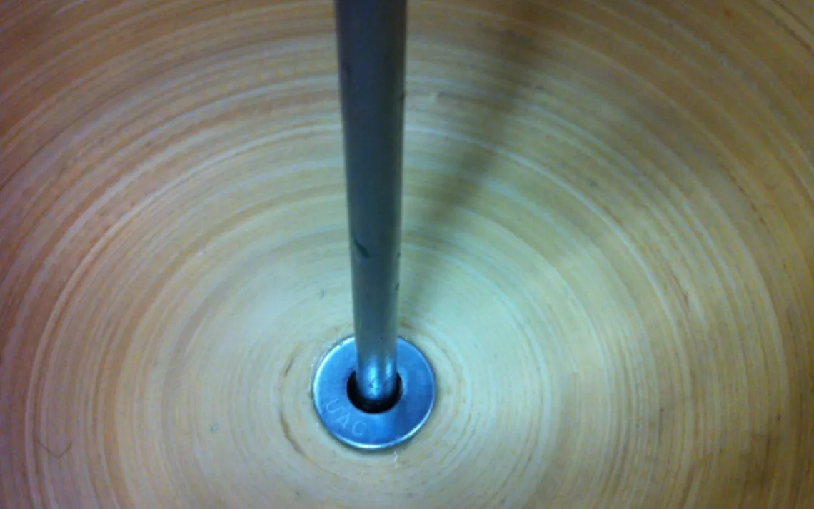  Add another washer, so the bowl is sandwiched between two washers, and apply more glue.