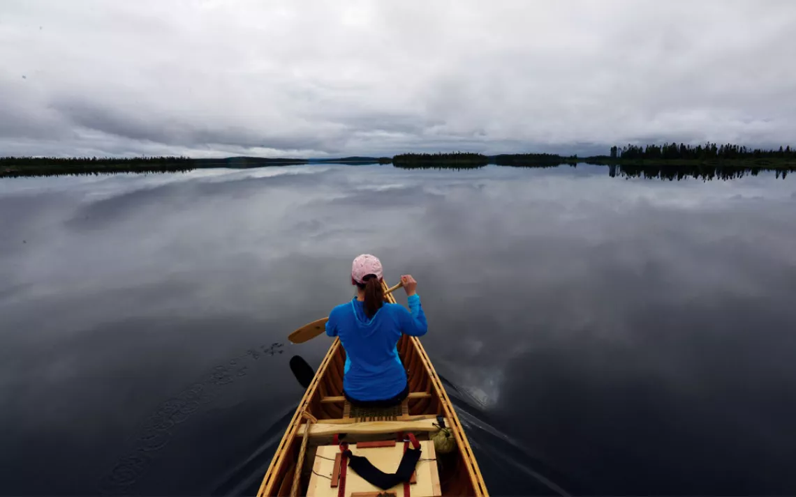 Pewter skies are reflected in the glassy water of Lacs Saindon, in remote northern Quebec.