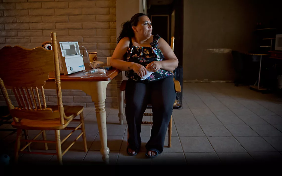 Surita Hernandez at home; she and four of her five children have asthma.