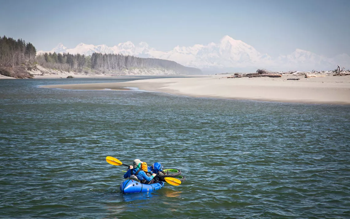 Crossing the Akwe River with Mt. Fairweather in the distance.