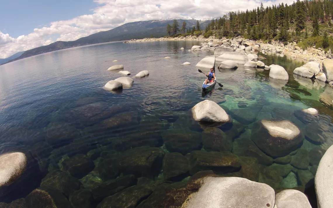 Kayaking on a lake outside of the Clair Tappaan Lodge.