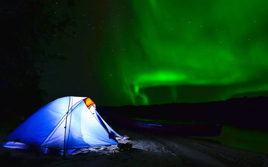 The northern lights shimmer above Attawapiskat Lake.