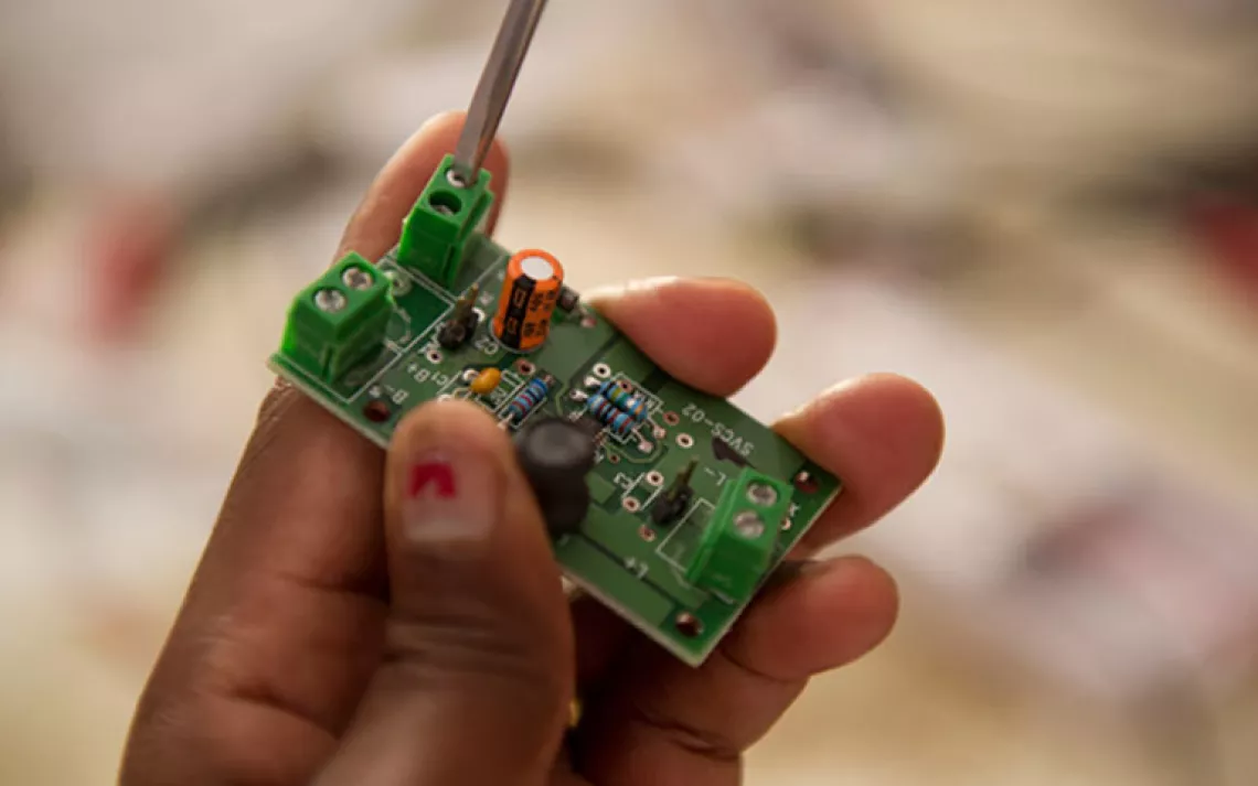 A close-up of a circuit board used in assembling the solar lanterns.