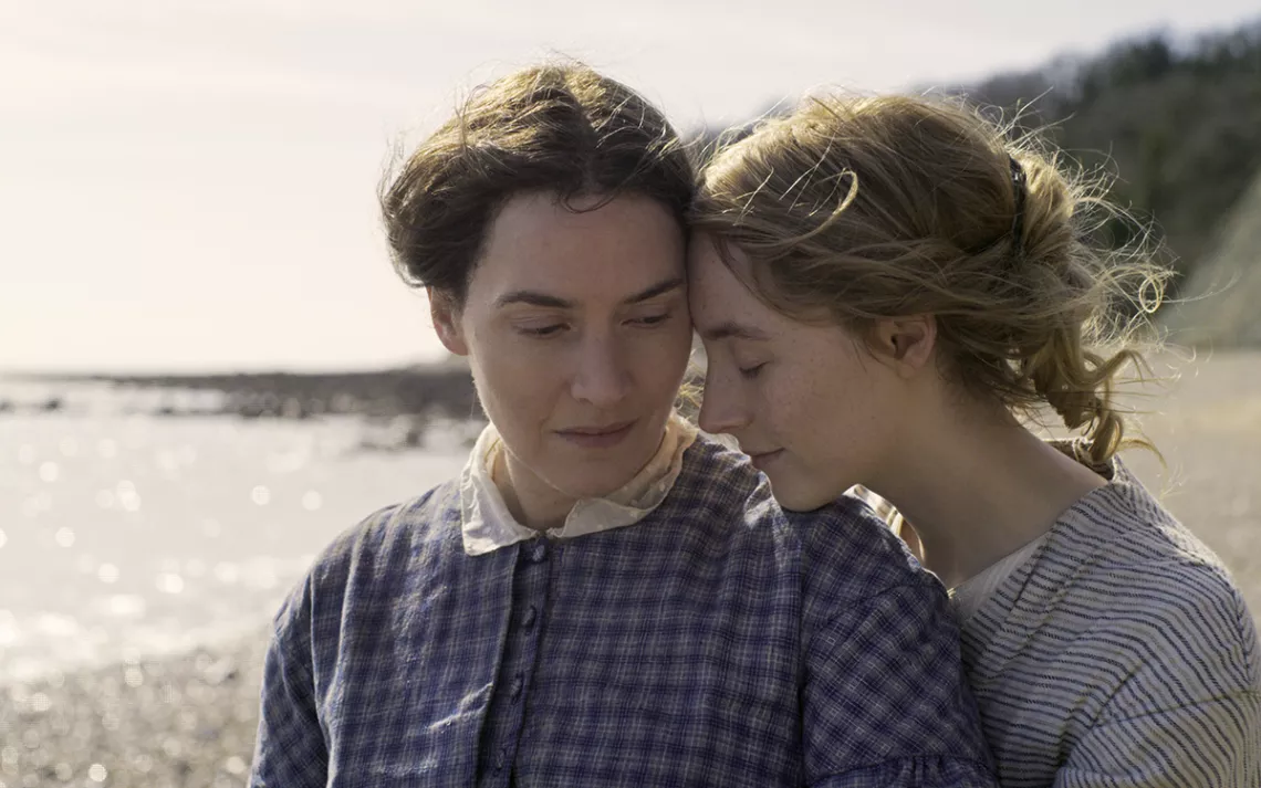 Saoirse Ronan and Kate Winslet barely touch their foreheads together with romantic longing.