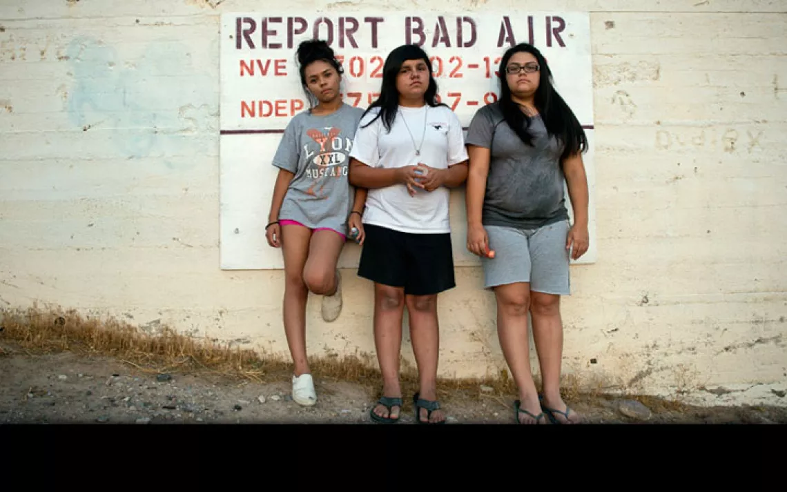 Aaliya, Ayona, and Zayda Hernandez near their home on the Moapa Band of Paiutes Reservation, about an hour north of Las Vegas. Since 1965, coal ash from the Reid Gardner Generating station has been dumped into uncovered ''ponds'' less than a half-mile fro