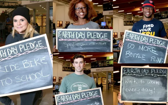 Students hold Earth Day Pledge signs that say "Ride Bike to School," "Spend more time with nature," "Do more bottle runs," and "Walk to work every day."