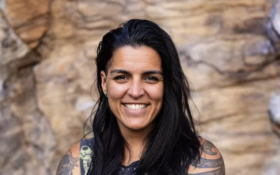 Chamorro climber Briana Mazzolini-Blanchard standing in front of a rock face