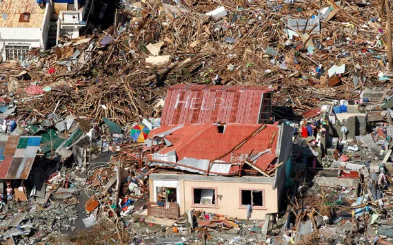 A sign for help is seen amid the destruction left from Typhoon Haiyan in the coastal town of Tanawan, central Philippines