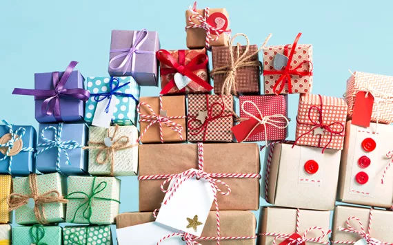 A pile of gift-wrapped boxes tied up with bows