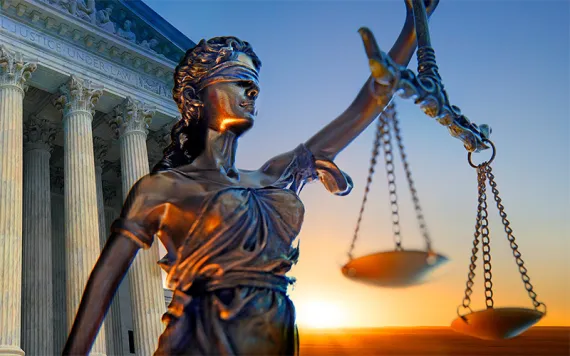 A statue of the blindfolded lady justice 
