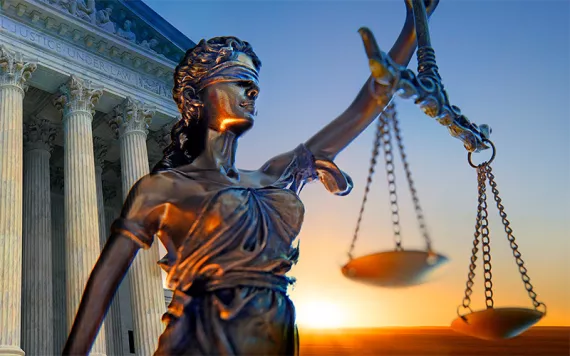 A statue of the blindfolded lady justice 