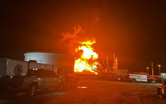 This image provided by Louisiana State Police shows a fire at a storage tank containing volatile naptha in Lake Charles, La., on Saturday night, June 3, 2023.